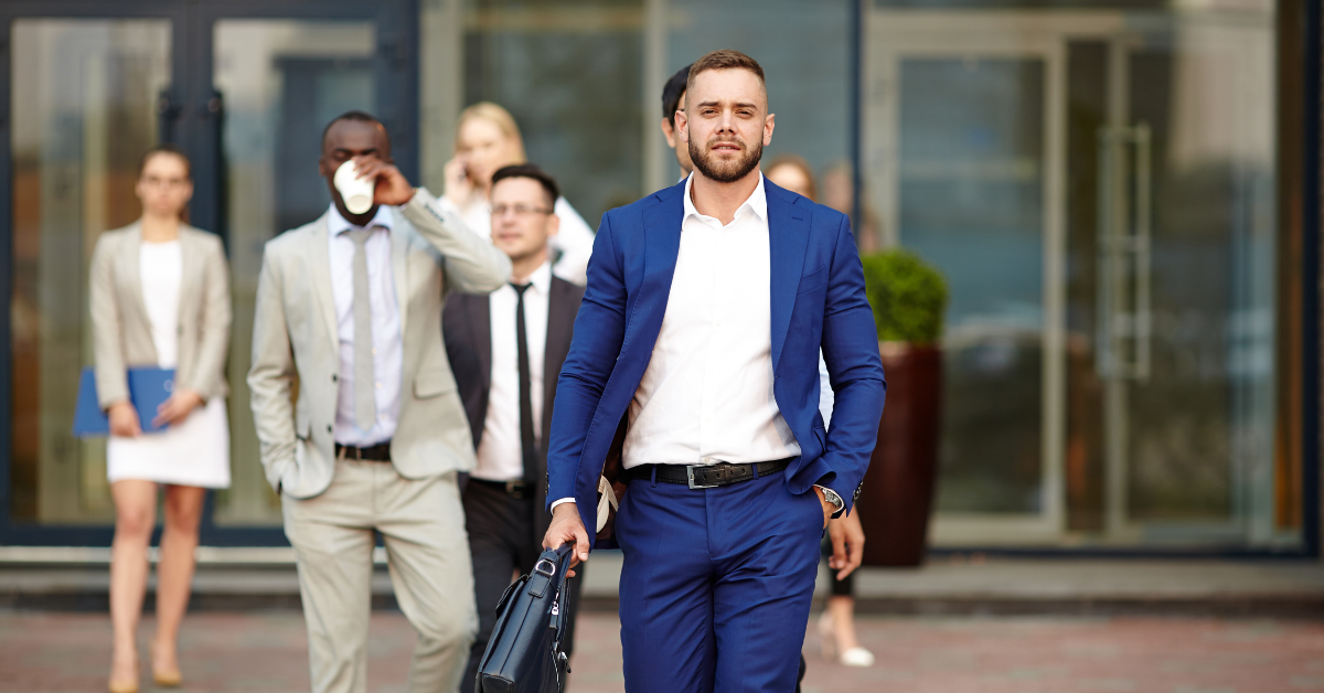 Employer Brand Blog Graphic that showcases a group of people in professional clothing walking outside.